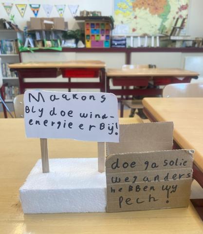 model-spandoeken met oproepen voor groener Woudenberg